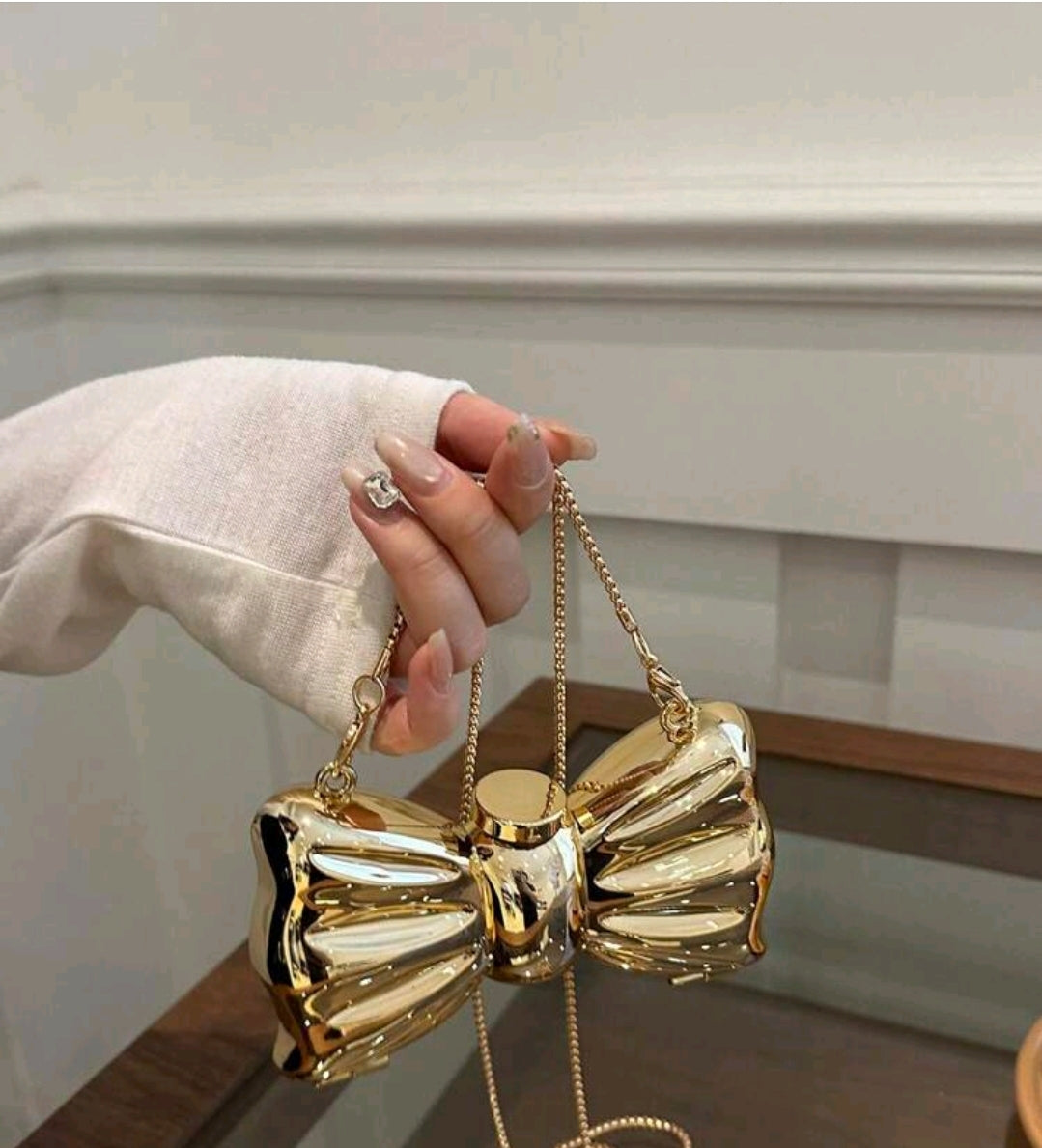Gold bow purse