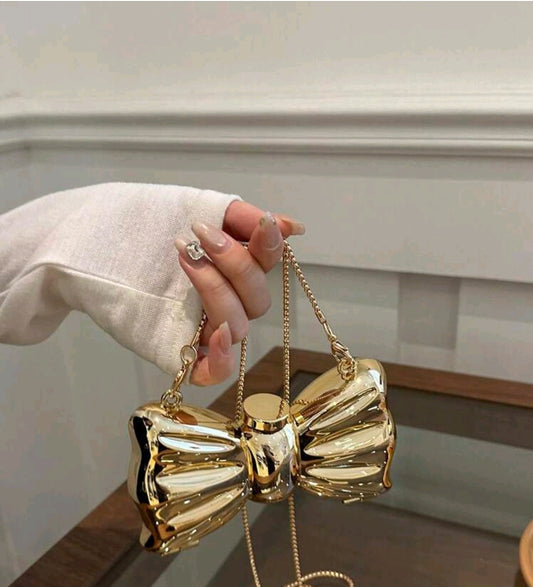 Gold bow purse